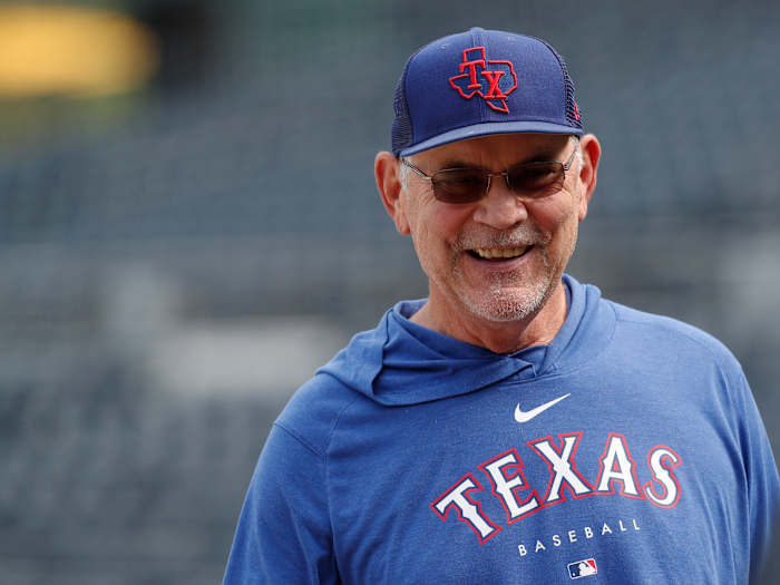 May 23, 2023; Pittsburgh, Pennsylvania, USA; Texas Rangers manager Bruce Bochy (15) smiles on the field before the game against the Pittsburgh Pirates at PNC Park. Mandatory Credit: Charles LeClaire-USA TODAY Sports